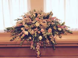 cream casket pink flowers