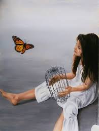 little girl releasing butterfly